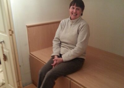 Mrs H sat On cabin Bed