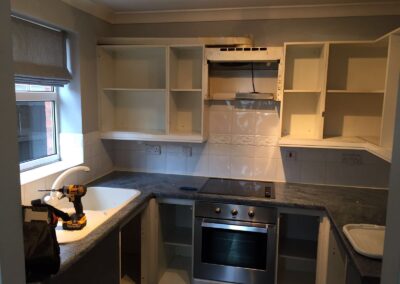 working on fully fitted kitchen