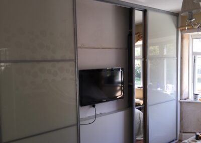 4 door sliding wardrobes with tv in place