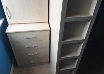 chest of drawers on high sleeper bed with desk and wardrobe