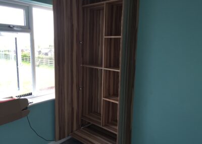 the fitted wardrobe in an alcove from floor to ceiling