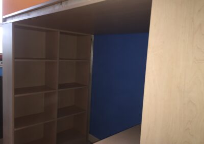open shelves on high sleeper bed with desk and wardrobe