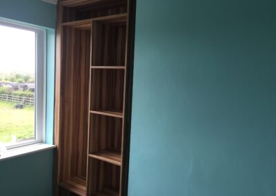 the fitted wardrobe in an alcove from floor to ceiling