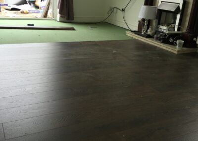 laminate flooring being fitted around the hearth