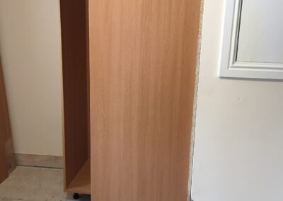Building a wardrobe over a stairs bulkhead wardrobe fitting into place