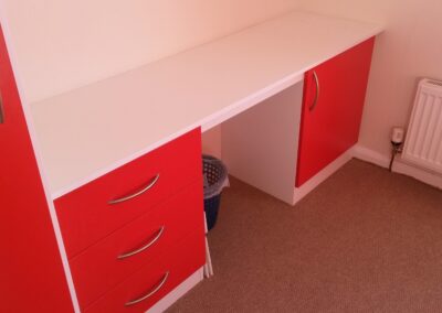 desk with red drawers