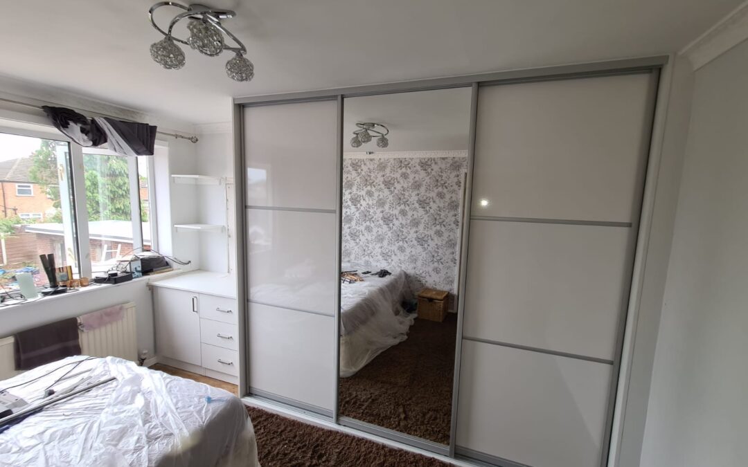 Fitted Wardrobe With Built In Drawers And A Desktop
